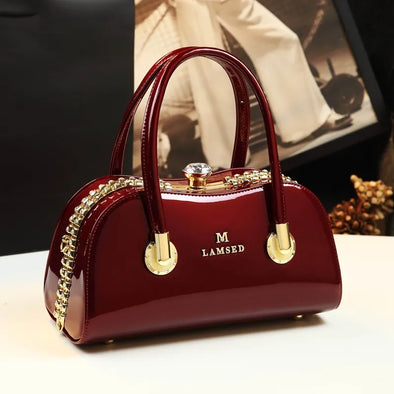 2024 New Fashionable Genuine Leather Women's Bag, Middle aged Mom's Bag, Versatile, Large Capacity, and Atmospheric Clip Handbag