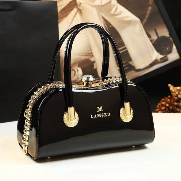 2024 New Fashionable Genuine Leather Women's Bag, Middle aged Mom's Bag, Versatile, Large Capacity, and Atmospheric Clip Handbag